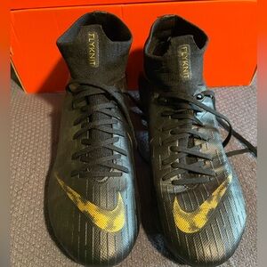 EUC worn once. Nike Mercurial cleats. Black & gold with Dynamic Sock. Women’s 9.